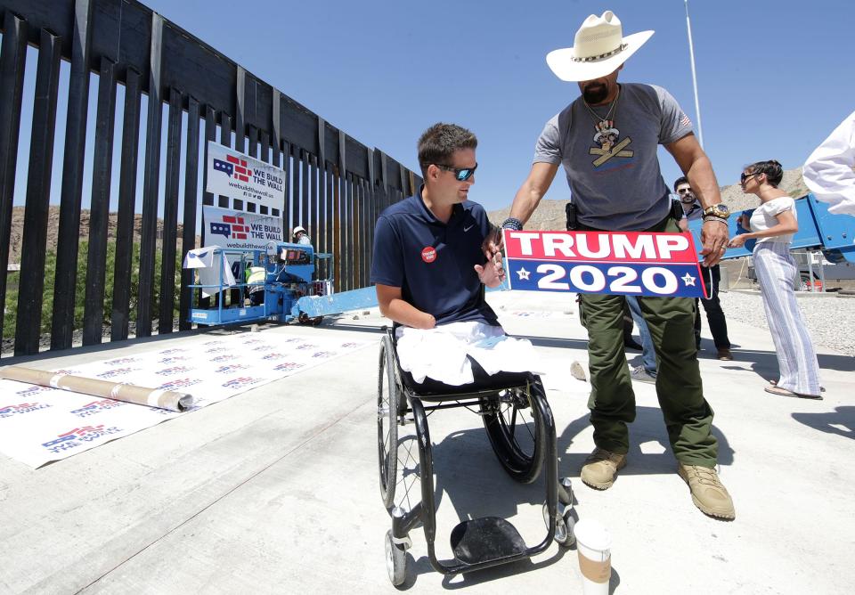 We Build the Wall Founder Brian Kolfage, left, and â€œSheriffâ€ David Clarke Jr., a board member, prepare for a press conference in Sunland Park, New Mexico where a citizen-funded bollard border fence is being built.