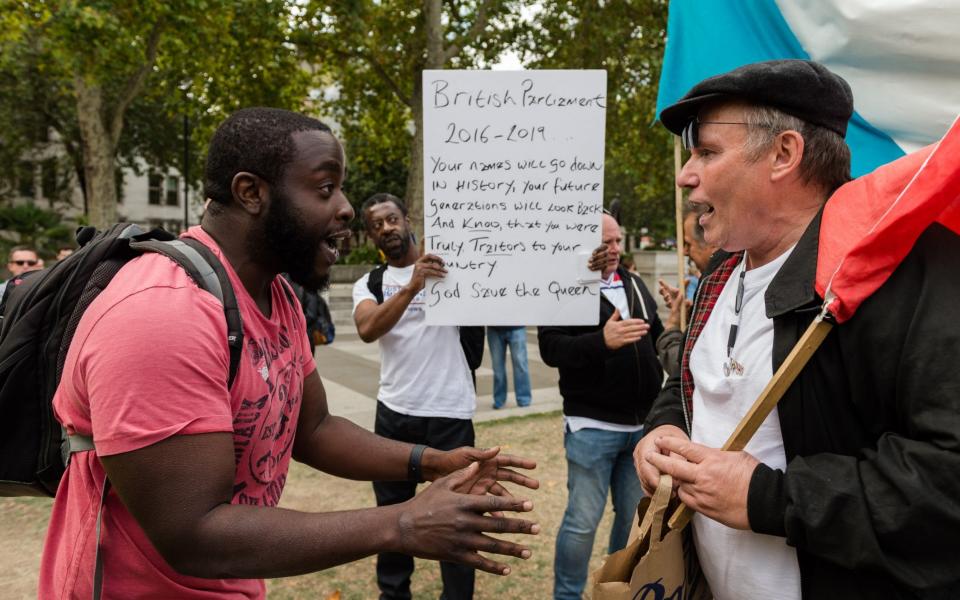 Pro-Brexit supporters of Tommy Robinson and Boris Johnson argue with a People's Vote demonstrator (L) in Parliament Square - Wiktor Szymanowicz/Barcroft Media