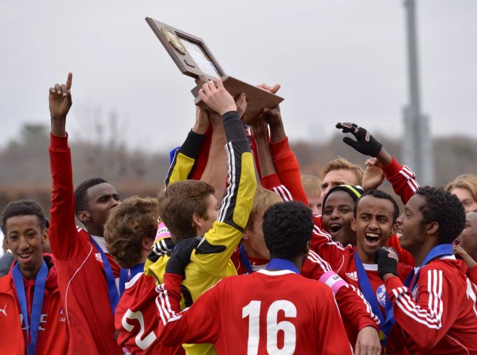 
The St. Cloud Apollo Eagles soccer team celebrates its State Class A title after defeating Minneapolis DeLaSalle 1-0 Thursday morning at Husky Stadium in St. Cloud.
