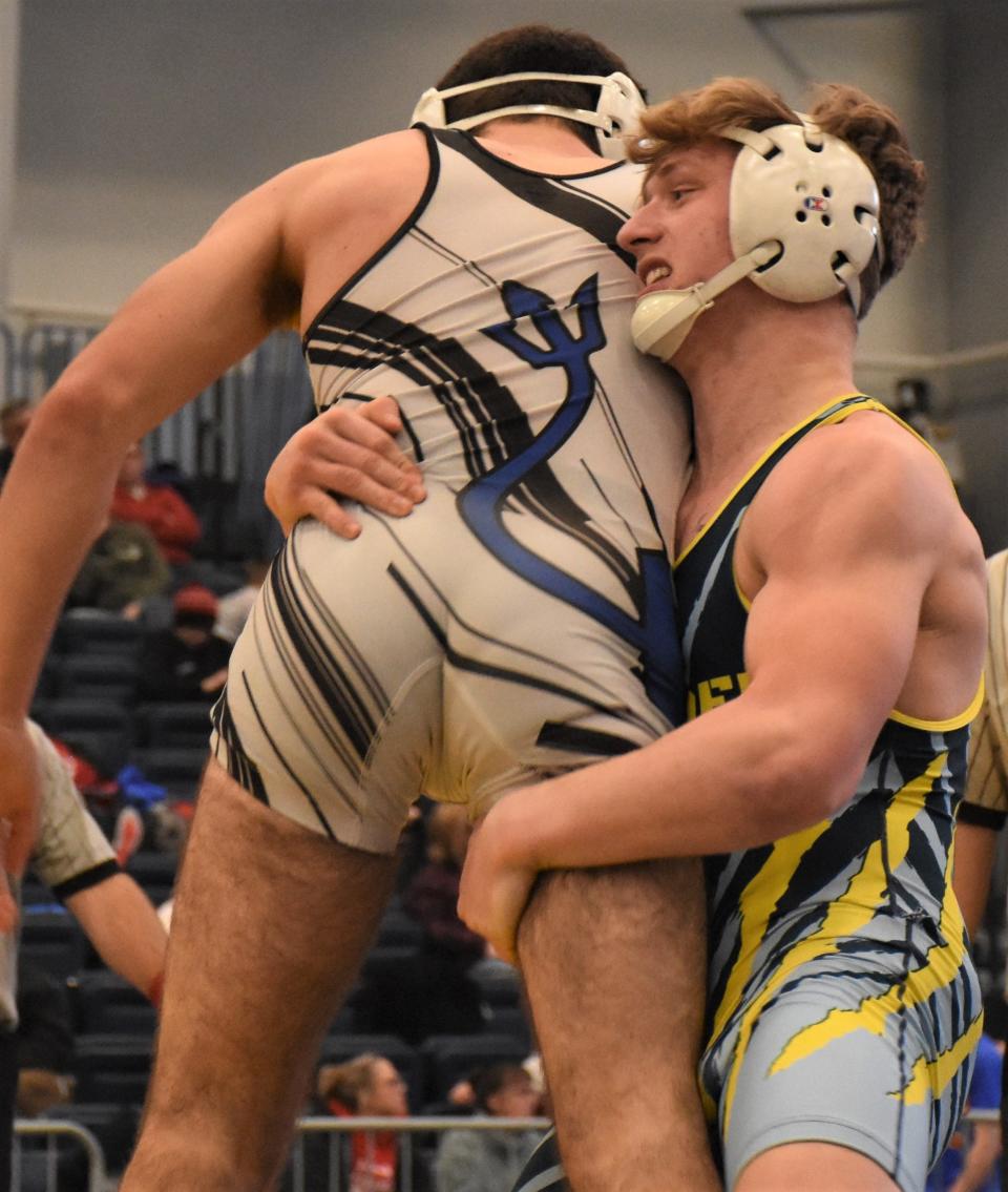 Central Valley Academy's Sixx Cook (right) lifts Camden's Sean Seymore during the 152-pound title bout at Section III's Division II championship meet in Syracuse. A third place finisher at the state meet last year, Cook is a semifinalist again. Seymore lost his first match Friday but won his first wrestleback in consolation competition.