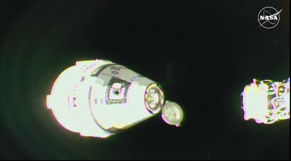 A view just after a white capsule undocked from the ISS.