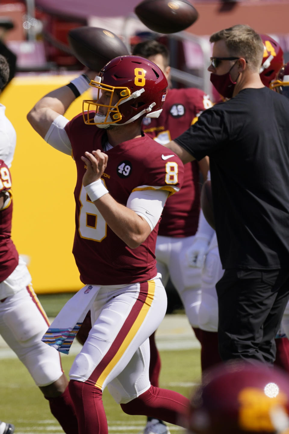 Washington Football Team quarterback Kyle Allen (8) warms up before the first half of an NFL football game between the Washington Football Team and the Baltimore Ravens, Sunday, Oct. 4, 2020, in Landover, Md. (AP Photo/Steve Helber)