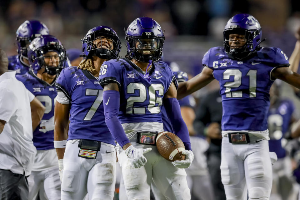 TCU's Channing Canada (7), Vernon Glover (26), and Bud Clark (21) celebrate Glover's interception of a Nicholls State pass during the second half of an NCAA college football game Saturday, Sept. 9, 2023, in Fort Worth, Texas. (AP Photo/Gareth Patterson)