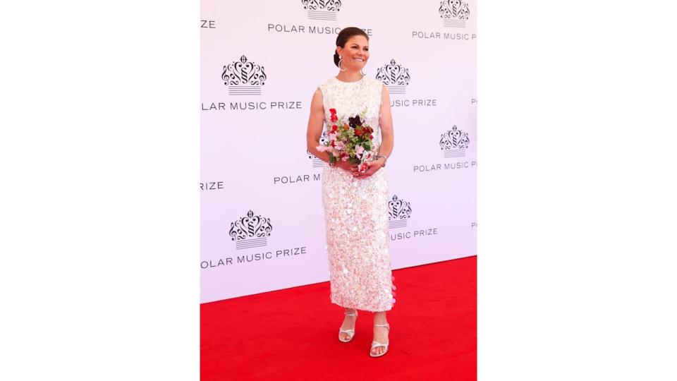 Crown Princess Victoria on red carpet in white sequin dress