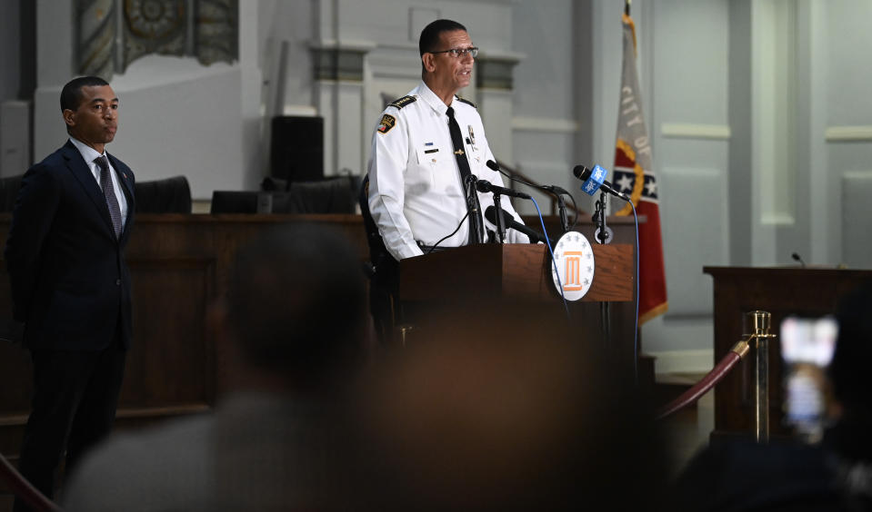 Montgomery, Ala., Mayor Steven Reed, left, listens to Police Chief Darryl Albert