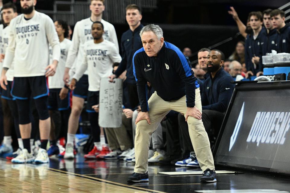 Duquesne coach Keith Dambrot keeps an eye on the action in the first half against Brigham Young during the first round of the NCAA Tournament on Thursday in Omaha, Neb.