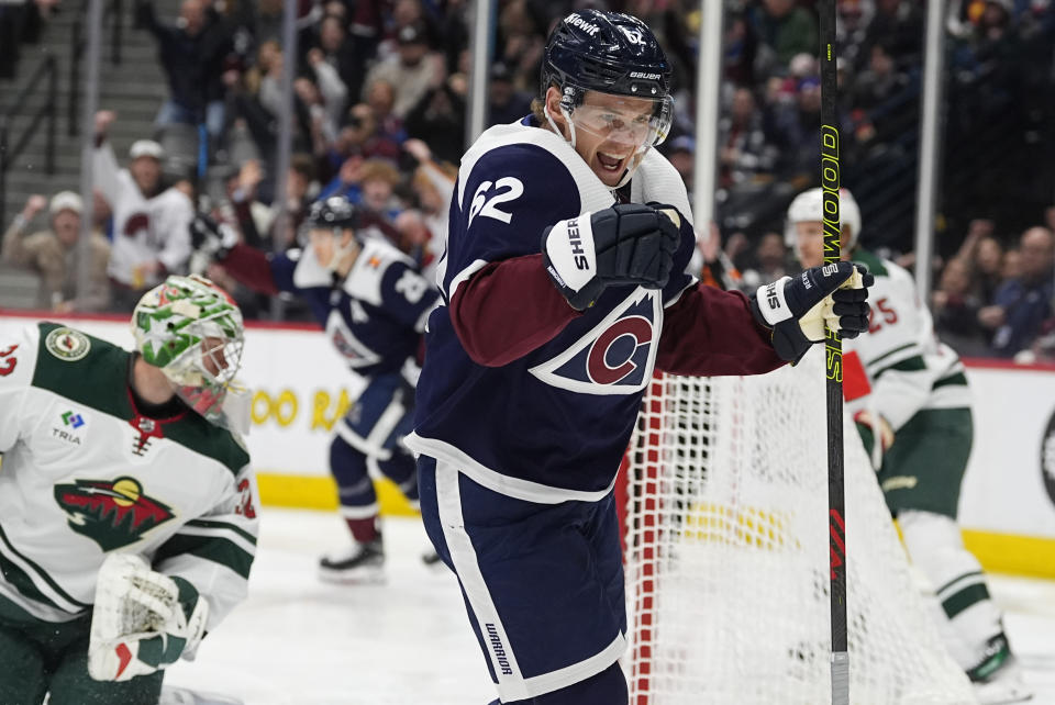 Colorado Avalanche left wing Artturi Lehkonen (62) reacts after scoring a goal past Minnesota Wild goaltender Filip Gustavsson in the first period of an NHL hockey game Friday, March 8, 2024, in Denver. (AP Photo/David Zalubowski)