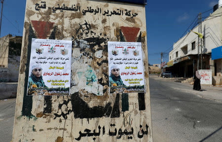 Pictures of 24-year-old Palestinian Mohammad al-Khatib are seen in Beit Rima village in the occupied West Bank, September 18, 2018. REUTERS/Mohamad Torokman