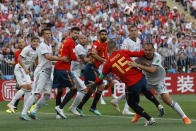 <p>Sergio Ramos and Sergei Ignashevich vie for the ball which hits Ignashevich and goes in for an own goal for Spain. </p>