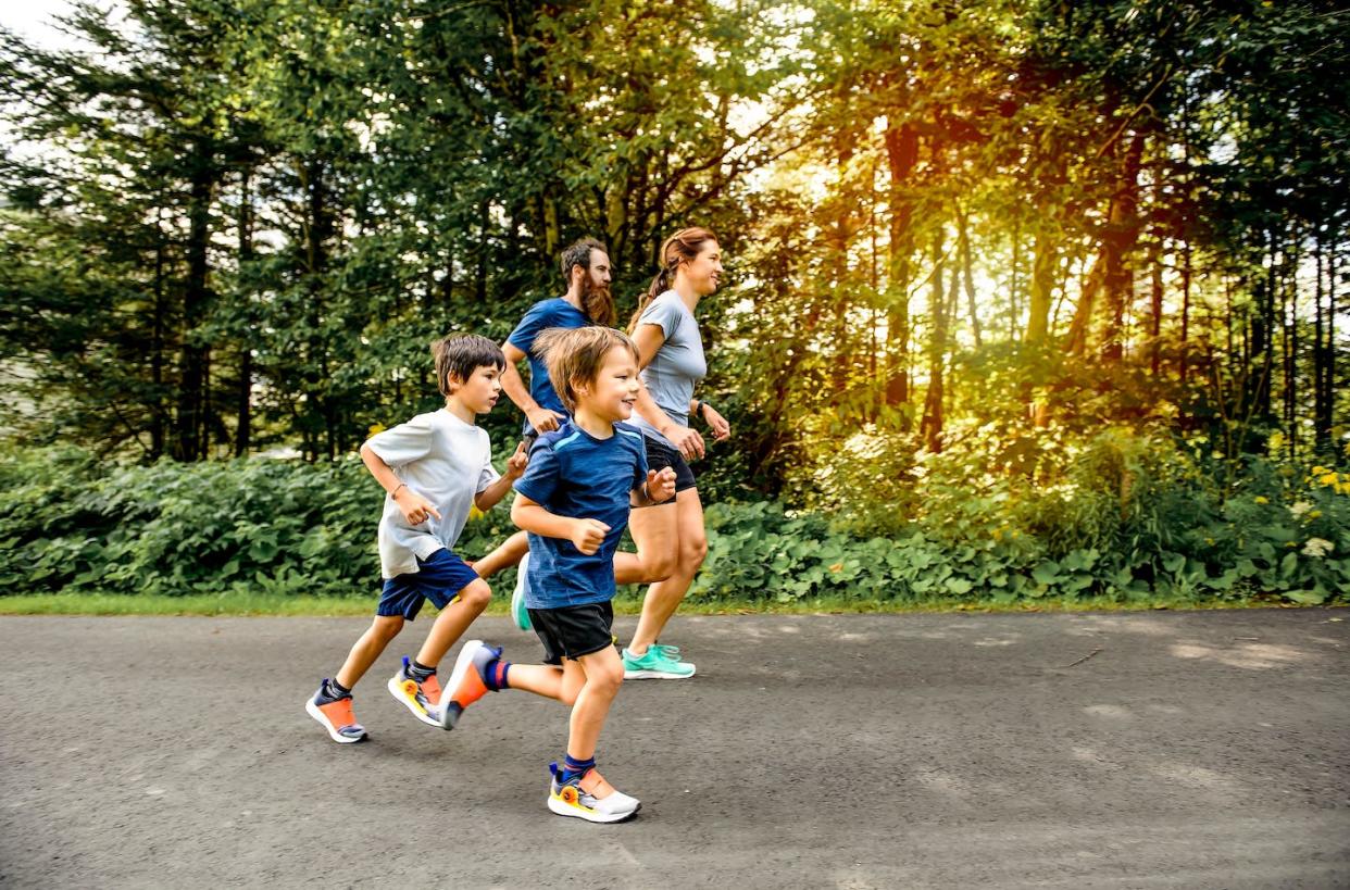 The perfect slow running pace is one where you can still easily have a conversation. <a href="https://www.shutterstock.com/image-photo/family-exercising-jogging-together-outdoor-park-2202219503" rel="nofollow noopener" target="_blank" data-ylk="slk:Lopolo/ Shutterstock;elm:context_link;itc:0;sec:content-canvas" class="link ">Lopolo/ Shutterstock</a>