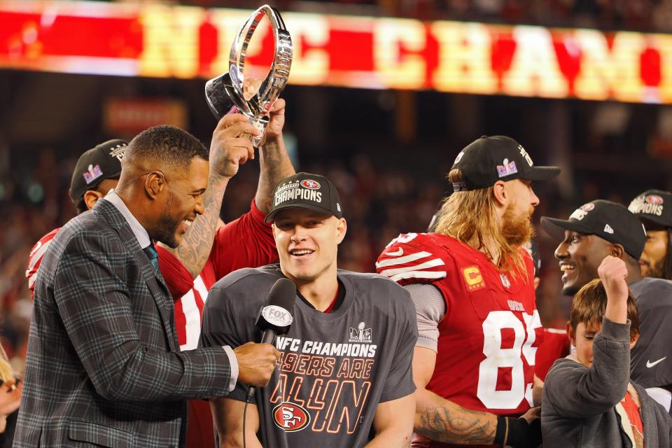 Jan 28, 2024; Santa Clara, California, USA; Fox Sports broadcaster and former NFL player Michael Strahan interviews San Francisco 49ers running back Christian McCaffrey (23) after winning the NFC Championship football game against the Detroit Lions at Levi's Stadium. Mandatory Credit: Kelley L Cox-USA TODAY Sports