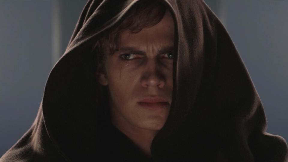 Hayden Christensen stands with a conflicted look on his face in Star Wars: Revenge of the Sith.