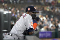 Houston Astros manager Dusty Baker Jr. wears a protective mask as he watches from the dugout during the fifth inning of the team's baseball game against the Chicago White Sox on Monday, Aug. 15, 2022, in Chicago. (AP Photo/Charles Rex Arbogast)