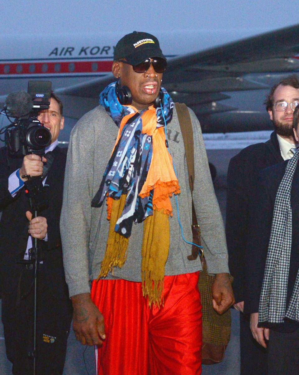 Retired U.S. basketball star Dennis Rodman arrives at Pyongyang airport