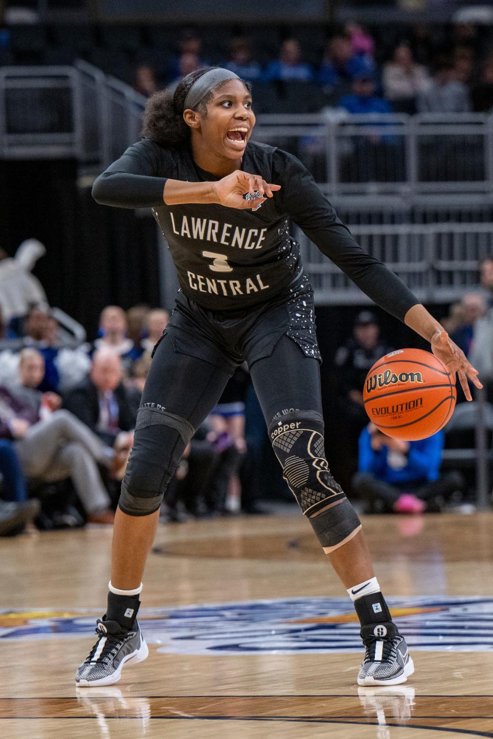 Lawrence Central High School sophomore Lola Lampley (3) gestures to her teammates as she brings the ball up court during the second half of an IHSAA class 4A girls’ basketball state finals game against Lake Central high School, Saturday, Feb. 24, 2024, at Gainbridge Fieldhouse, in Indianapolis. Lawrence Central won the school’s first state championship title in girl’s basketball.