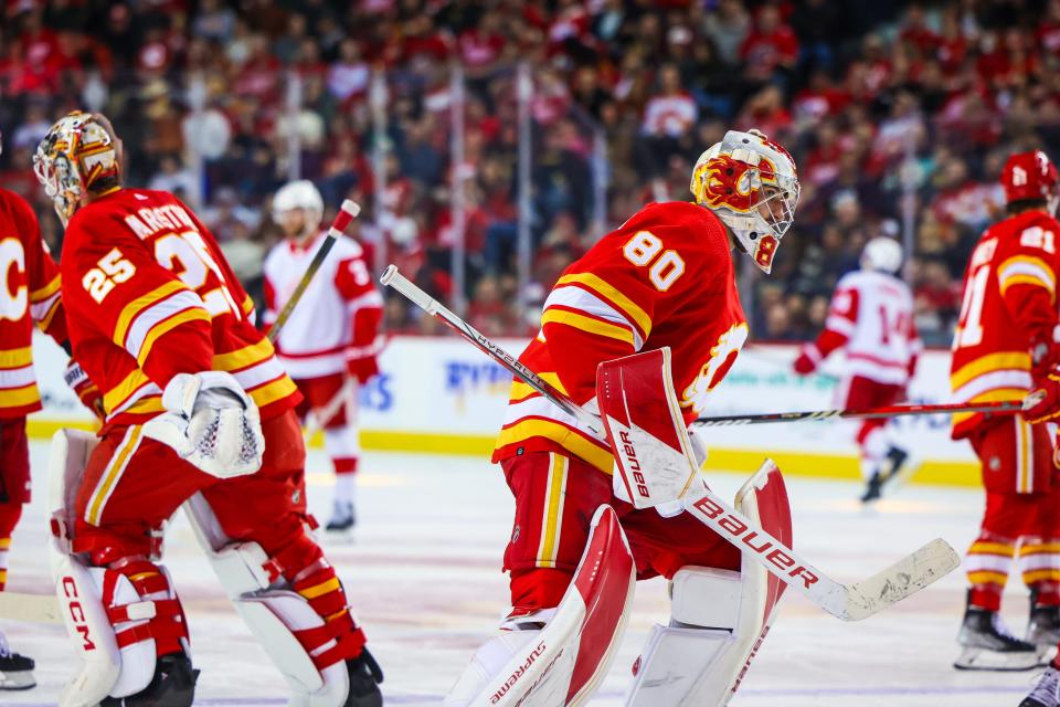 Calgary Flames goaltender Dan Vladar (80) replaces Calgary Flames goaltender Jacob Markstrom (25) during the second period against the Detroit Red Wings at Scotiabank Saddledome in Calgary, Alberta, on Saturday, Feb. 17, 2024.