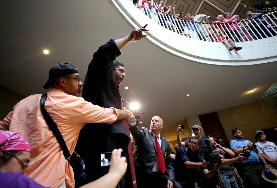 Rev. William Barber II tells protesters not to boo the local authorities’ efforts to keep the crowd safe during the Moral Monday protests at the North Carolina Legislative Building in downtown Raleigh on July 8, 2013. Participants in the weekly state NAACP-led Moral Monday protests criticized legislation from a majority Republican legislature under former Republican Gov. Pat McCrory.