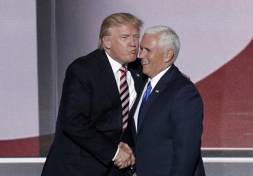 <p>Republican presidential nominee Donald Trump (L) greets vice presidential nominee Mike Pence after Pence spoke during the third day of the Republican National Convention in Cleveland, Ohio, July 20, 2016. (Photo: Mike Segar/Reuters) </p>