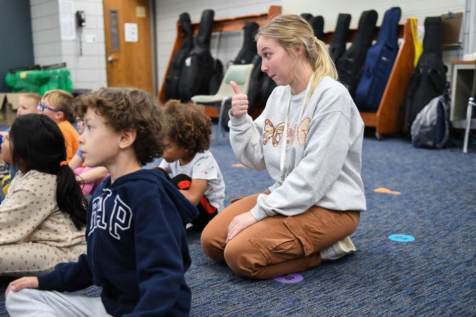 Kindergarten teacher Jeryn Mediger sits with her students during music class on Thursday, Oct. 5, 2023 at John F. Kennedy Elementary in Sioux Falls, South Dakota.