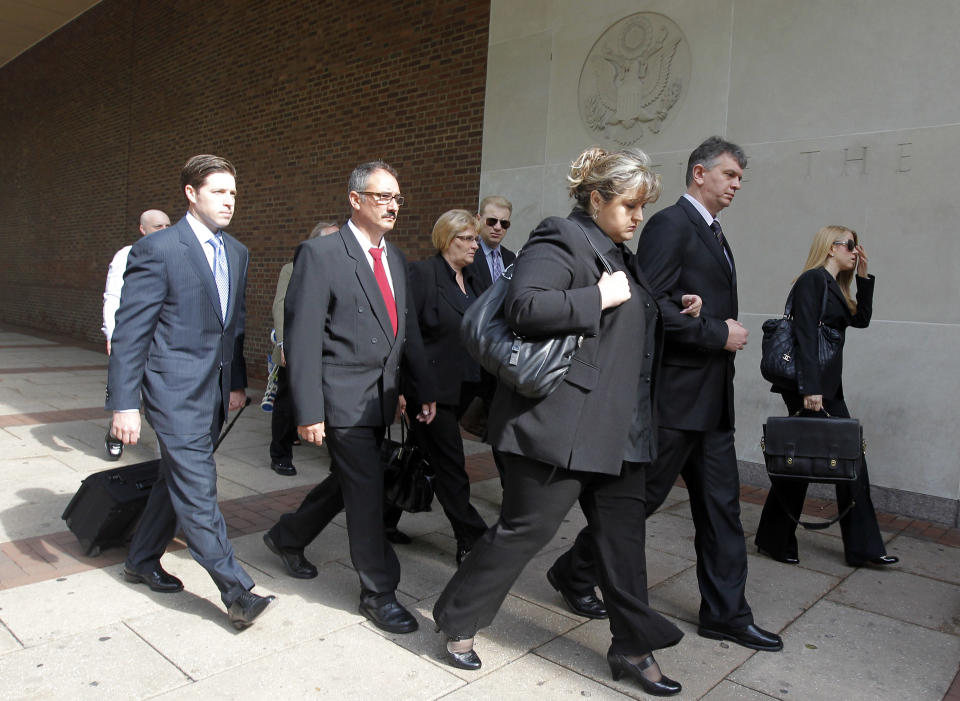Family members of two Hungarian students killed in a 2010 sightseeing boat accident and their attorneys arrive at the U.S. Courthouse for a federal wrongful death trial, Monday, May 7, 2012, in Philadelphia. Szabolcs Prem, 20, and Dora Schwendtner, 16, died when the boat they were on was run over by a barge. Relatives include Szabolcs' parents, Sandor Prem, second left, and Maria Prem, and Dora's mother Aniko Takacs, third from right. (AP Photo/Matt Rourke)