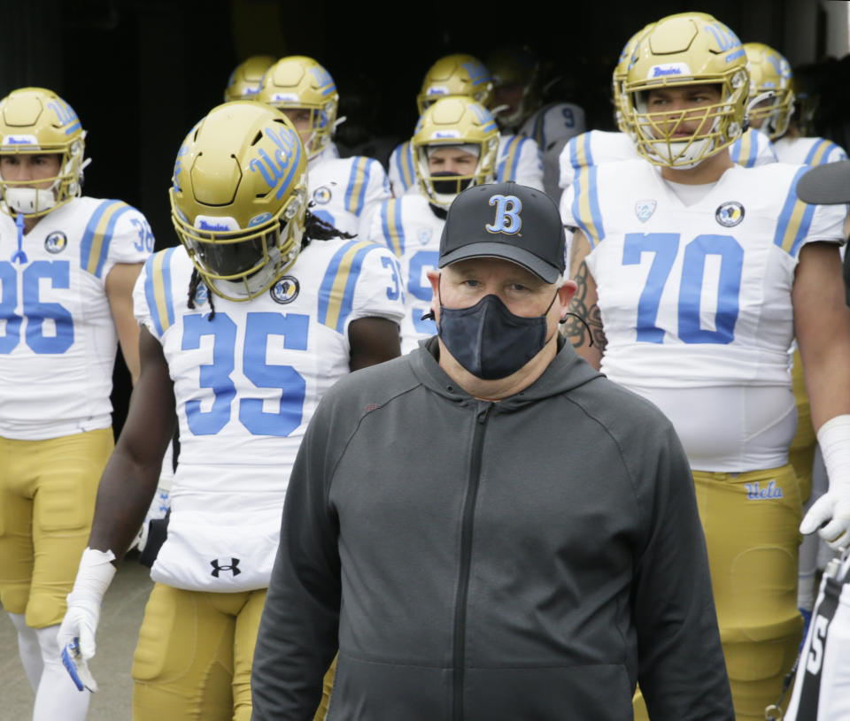 UCLA head coach Chip Kelly leads his team on the field before an NCAA college football game against Oregon, Saturday, Nov. 21, 2020, in Eugene, Ore. (AP Photo/Chris Pietsch)