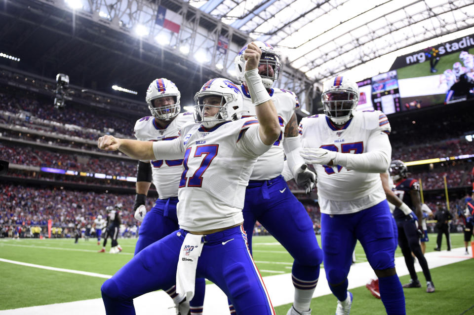 Buffalo Bills quarterback Josh Allen (17) celebrates after catching a pass for a touchdown against the Houston Texans during the first half of an NFL wild-card playoff football game Saturday, Jan. 4, 2020, in Houston. (AP Photo/Eric Christian Smith)