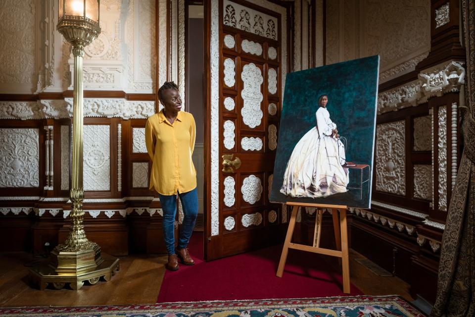 Artist Hannah Uzor with her painting of Sarah Forbes Bonetta, Queen Victoria’s African goddaughterPA