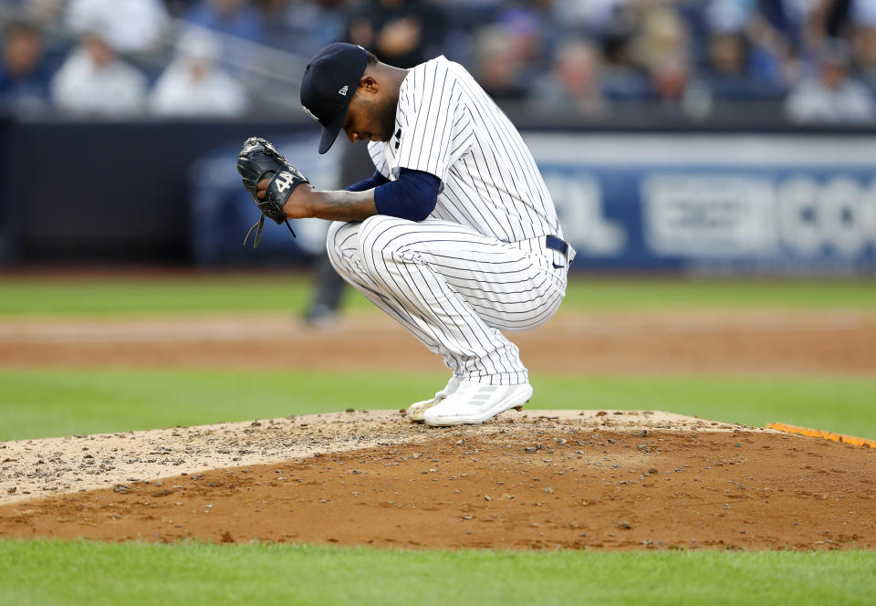 New York Yankees starting pitcher Domingo German pauses during a video review in the third inning of the team's baseball game against the Seattle Mariners, Thursday, June 22, 2023 in New York. (AP Photo/Noah K. Murray)