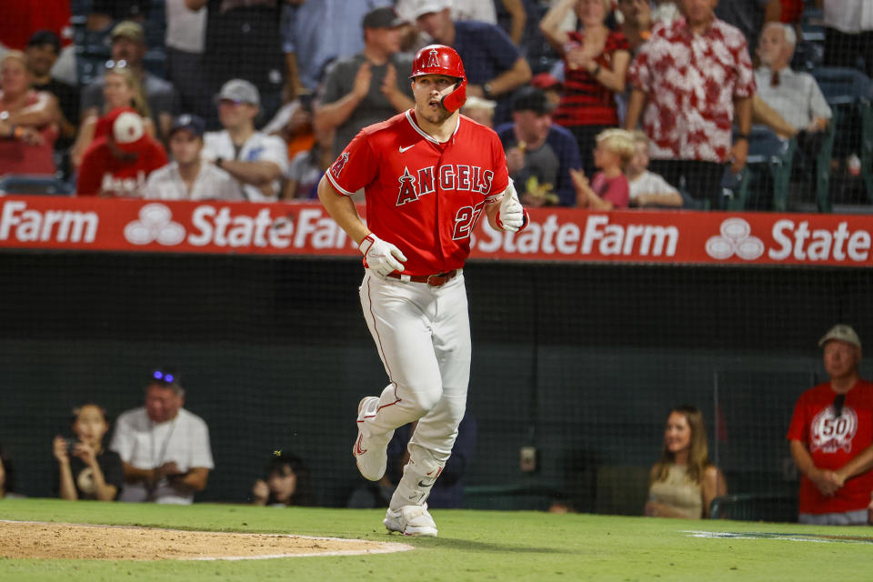 Los Angeles Angels' Mike Trout runs back to dugout after scoring on his solo home run during the fifth inning of a baseball game against the Detroit Tigers in Anaheim, Calif., Monday, Sept. 5, 2022. (AP Photo/Ringo H.W. Chiu)