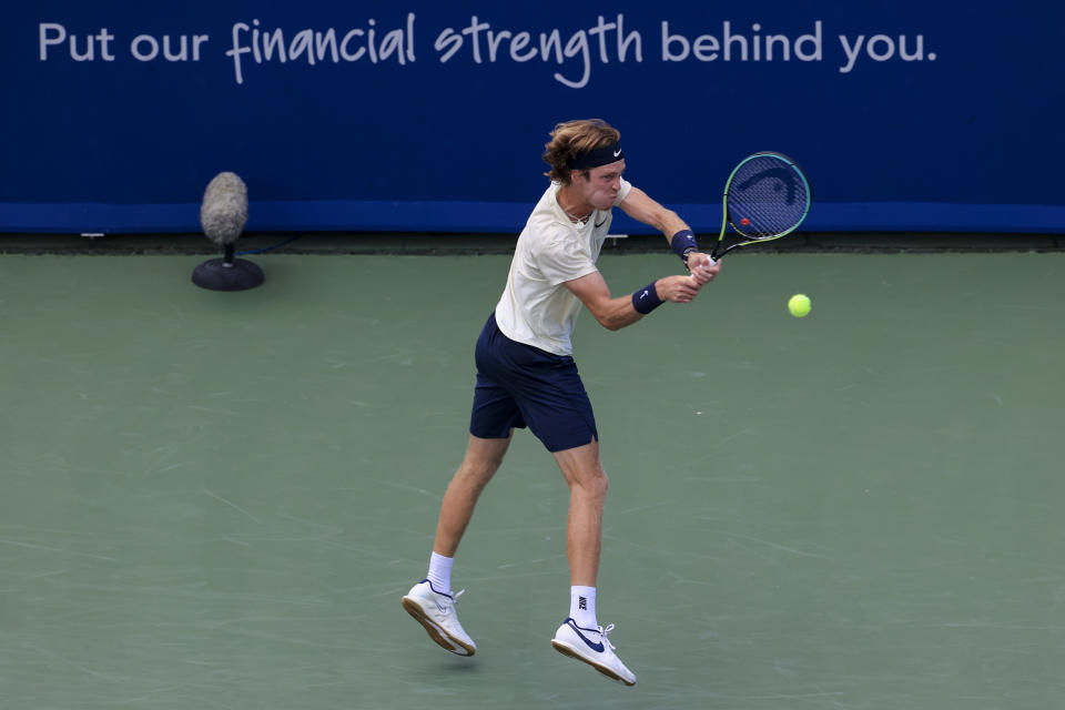 Andrey Rublev, of Russia, returns to Alexander Zverev, of Germany, during the men's single final of the Western & Southern Open tennis tournament Sunday, Aug. 22, 2021, in Mason, Ohio. (AP Photo/Aaron Doster)