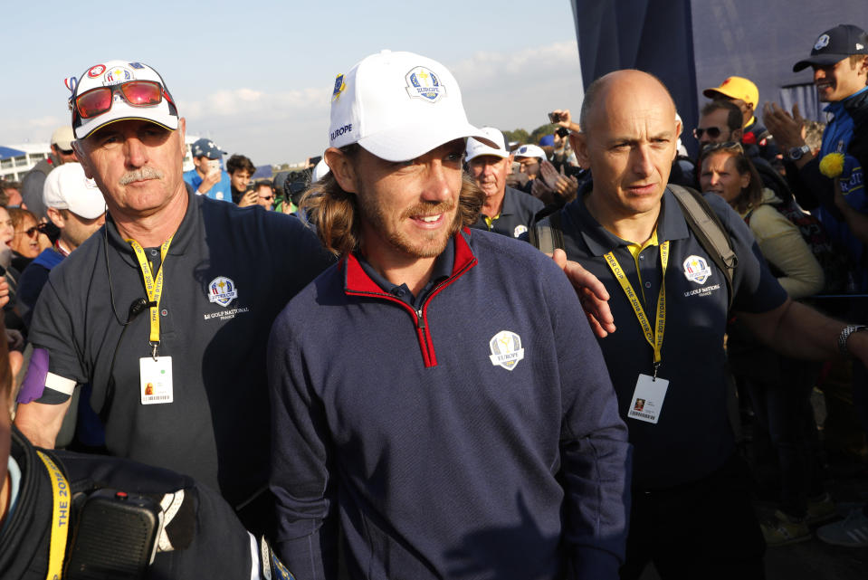 Europe's Tommy Fleetwood leaves the course after winning his foursome match on the opening day of the 42nd Ryder Cup at Le Golf National in Saint-Quentin-en-Yvelines, outside Paris, France, Friday, Sept. 28, 2018. Molinari and Fleetwood beat Justin Thomas of the US and Jordan Spieth 5 and 4. (AP Photo/Laurent Cipriani)