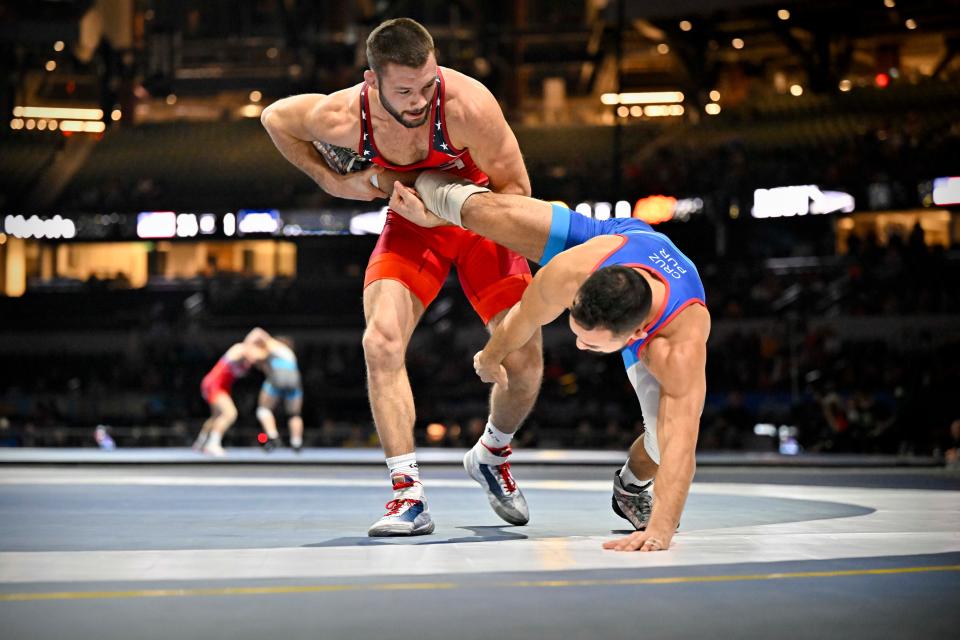 Thomas Gilman, left, wrestles Puerto Rico's Darian Cruz at the Bout at the Ballpark in February.