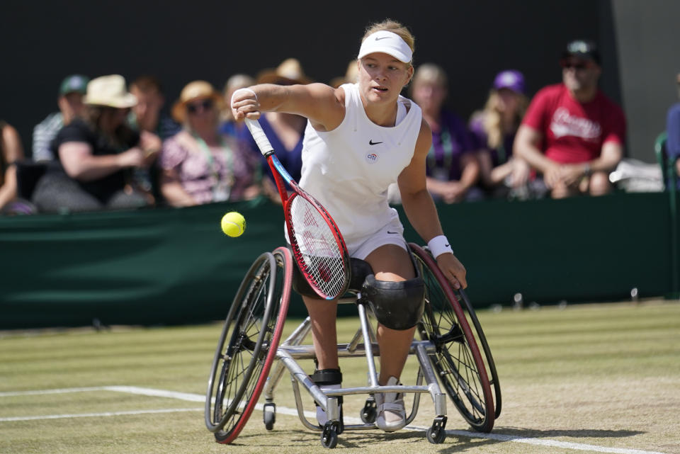 Diede De Groot of the Netherlands returns to Japan's Yui Kamiji in the final of the women's wheelchair singles on day thirteen of the Wimbledon tennis championships in London, Saturday, July 9, 2022. (AP Photo/Gerald Herbert)