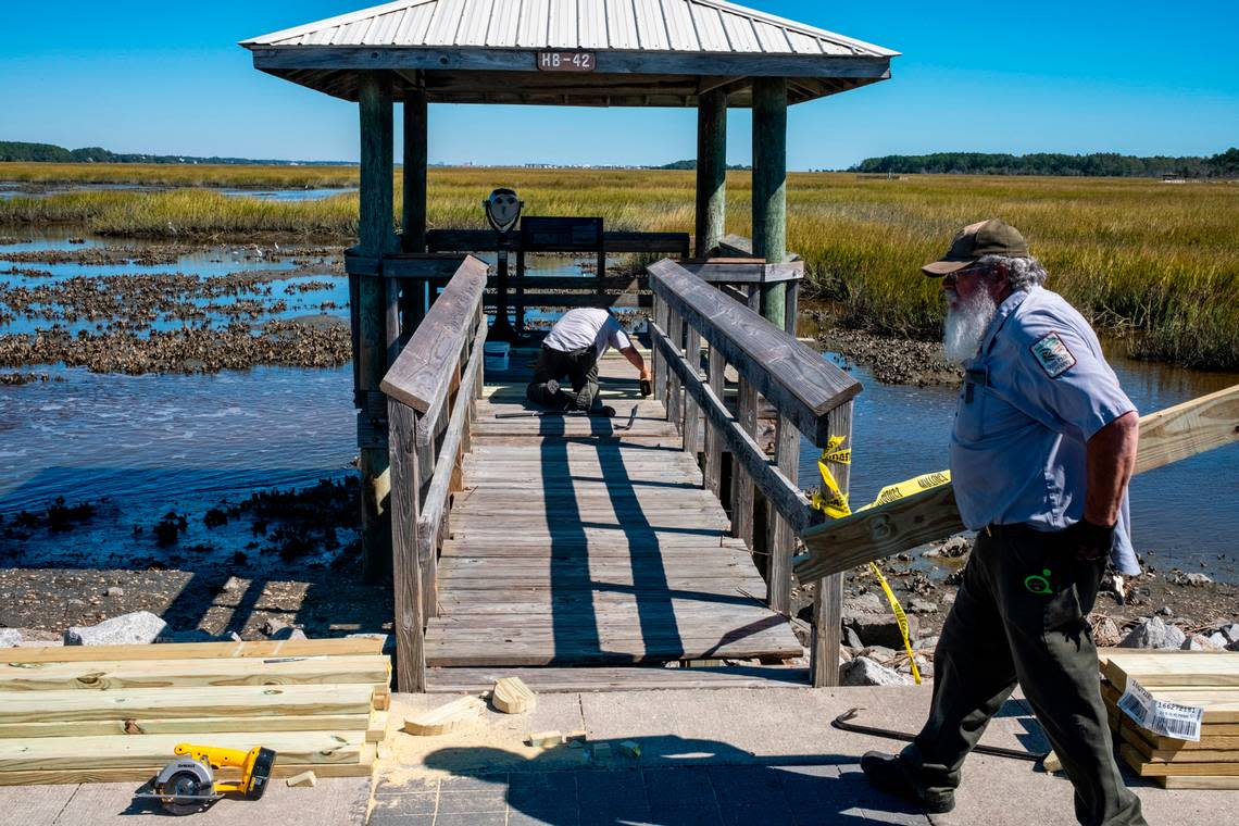 Rolfs Hargrave and Carl Whetsel, from Lee State Park work to repair the viewing piers along the causeway at Huntington Beach State Park in Murrells Inlet following Hurricane Ian. Volunteers and state park workers from around South Carolina have worked to repair Huntington Beach State Park for days since Hurricane Ian brought damaging flooding to the popular attraction. Oct. 5, 2022.