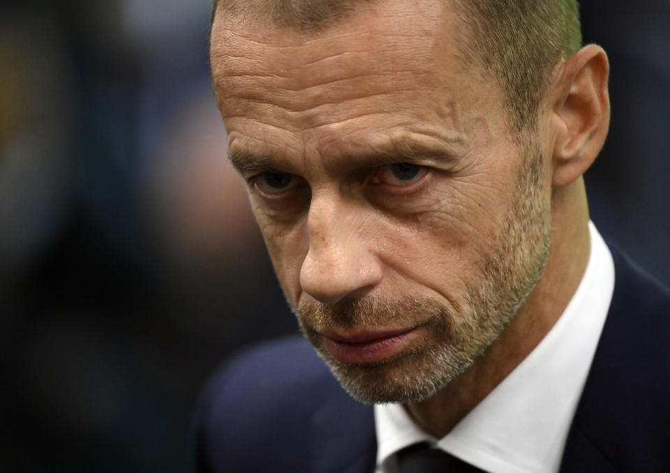 FILE - UEFA President Aleksander Ceferin at the UEFA Nations League semifinal soccer match between Italy and Spain at the San Siro Stadium, in Milan, Italy, Oct. 6, 2021. A group of top soccer clubs face Champions League organizer UEFA in court on Monday, July 11, 2022, for a legal match that risks the biggest upheaval in European soccer for more than 25 years. The Super League project failed at launch 15 months ago but the company formed by the 12 rebel clubs — now led by Real Madrid, Barcelona and Juventus — has brought a case to the Court of Justice of the European Union in Luxembourg. (Marco Bertorello/Pool via AP, File)