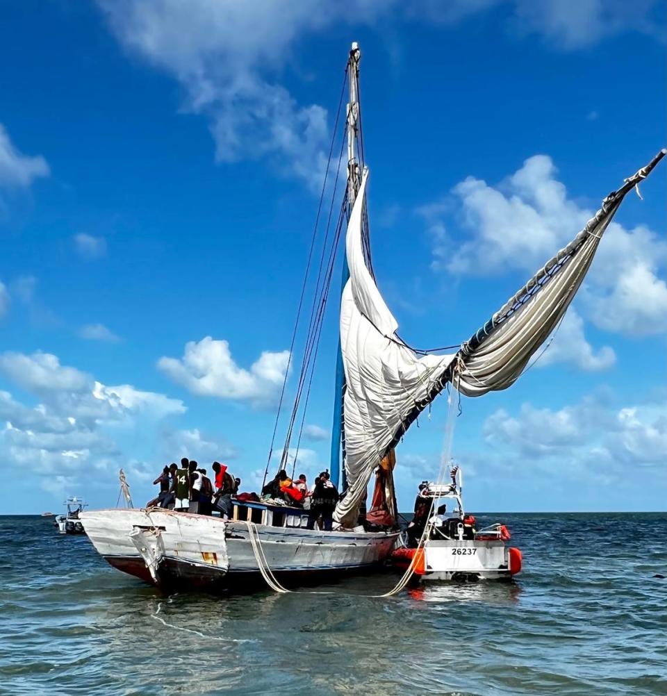 A migrant boat sits grounded off shore of the gated Ocean Reef community in north Key Largo Saturday, Aug. 6, 2022.