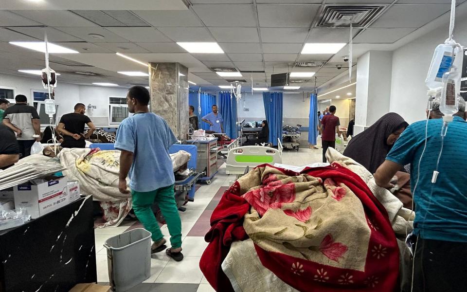 Medics attend to patients at the Al-Shifa hospital in Gaza City amid ongoing battles between Israel and Hamas