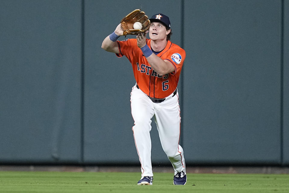 Houston Astros center fielder Jake Meyers catches a fly ball hit by New York Yankees' Giancarlo Stanton during the sixth inning of a baseball game Friday, March 29, 2024, in Houston. (AP Photo/Kevin M. Cox)