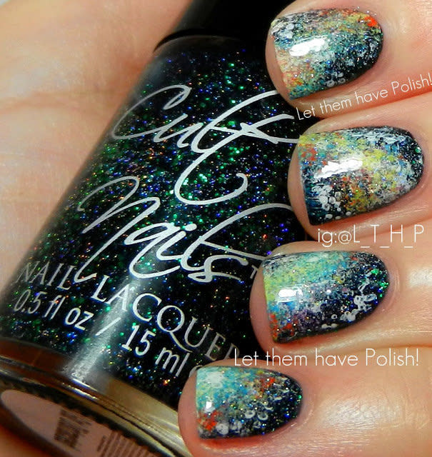 "This weekend, I got to work on a super fun 'Galactic Mani' while doing the 31 Day Nail Art Challenge. This look features Cult Nails' I Got Distracted as the base color and several shades by Bettina for the nebula designs. I created it with the sponge technique." - Cristina of <a href="http://www.letthemhavepolish.com/">Let Them Have Polish</a>