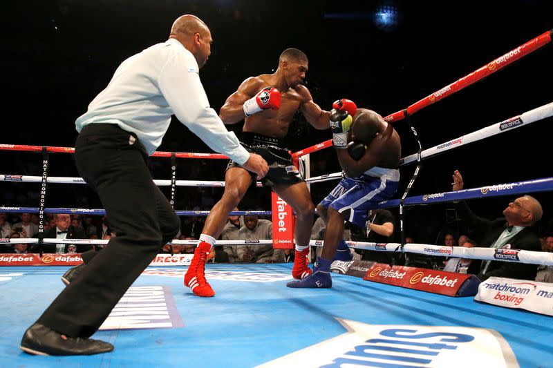 FILE PHOTO: Britain's Anthony Joshua floors American Kevin Johnson en route to a technical knockout victory to retain the WBC heavyweight title at the O2 Arena in London.