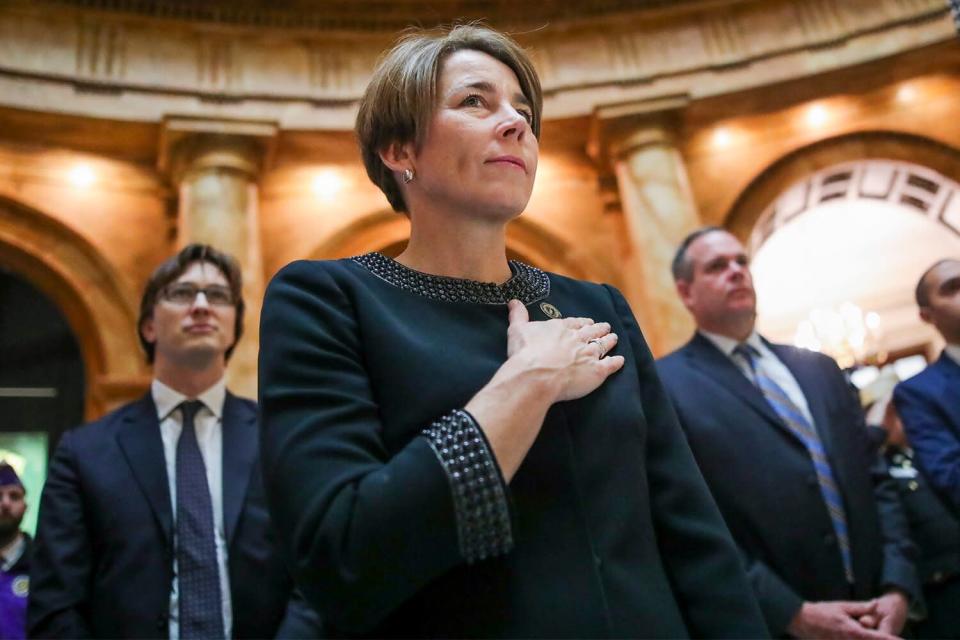 Massachusetts Attorney General Maura Healey participates in the Pledge of Allegiance during the annual Veterans Day ceremony at the Massachusetts State House on Sunday, November 11, 2018 in Boston, Massachusetts.