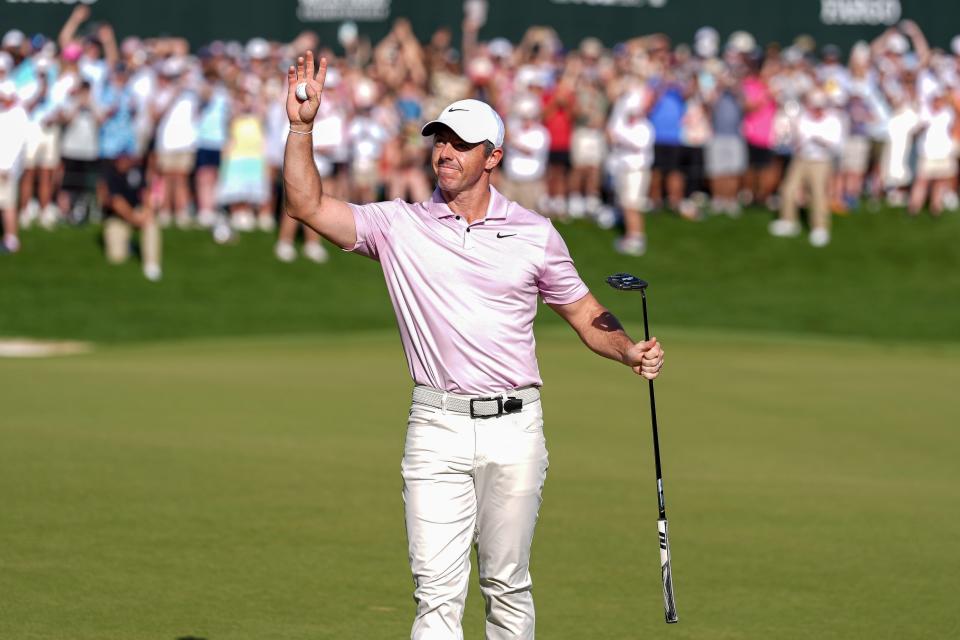 May 12, 2024; Charlotte, North Carolina, USA; Rory McIlroy acknowledges the gallery after his final putt and win during the final round of the Wells Fargo Championship golf tournament. Mandatory Credit: Jim Dedmon-USA TODAY Sports