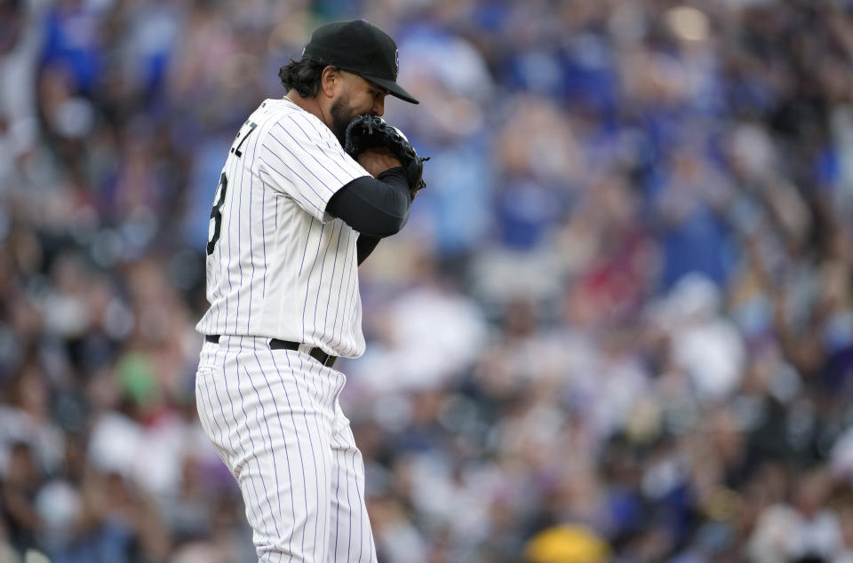 Colorado Rockies starting pitcher German Marquez reacts after giving up a two-run home run to Kansas City Royals' Salvador Perez during the third inning of a baseball game Saturday, May 14, 2022, in Denver. (AP Photo/David Zalubowski)