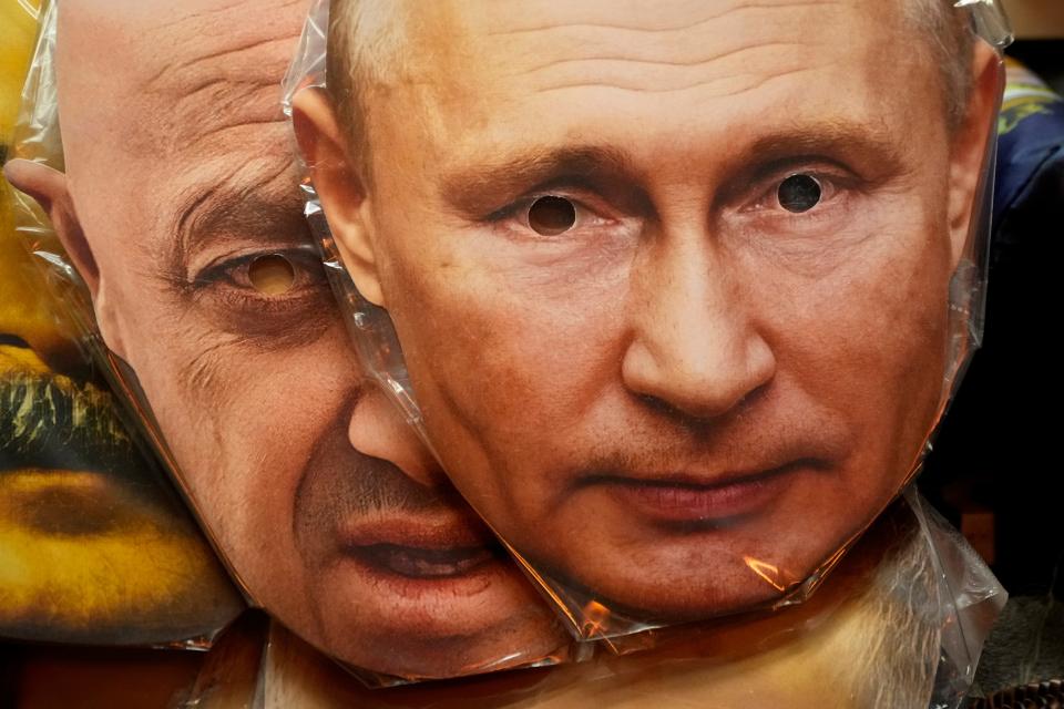 Face masks depicting Russian President Vladimir Putin, right, and the late owner of private military company Wagner Group, Yevgeny Prigozhin, are displayed among others for sale at a souvenir shop in St. Petersburg, Russia, on Aug. 27, 2023.