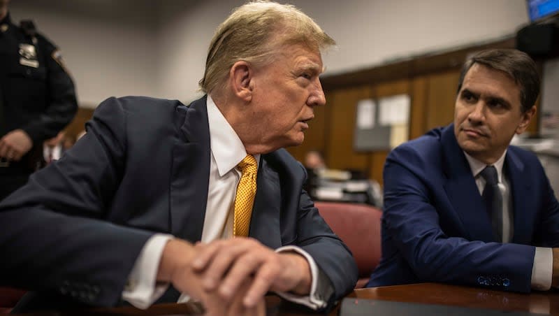 Former President Donald Trump sits in a courtroom next to his lawyer Todd Blanche before the start of the day's proceedings in the Manhattan Criminal court, Tuesday, May 21, 2024, in New York.