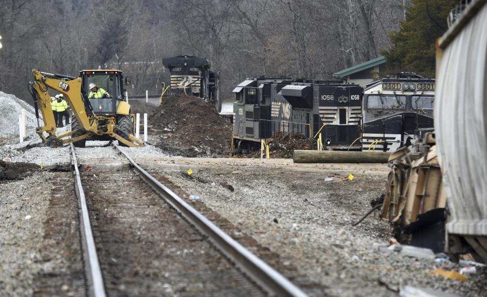 Locomotives rest along the side of the tracks as workers repair the tracks at the site of the train derailment at the intersection of the tracks with Apison Pike on Wednesday, Dec. 21, 2022. The driver of a semi-truck involved in the derailment has been charged. News outlets reported on Wednesday, Jan. 11, 2023 that Collegedale Police arrested the driver and charged him with failure to yield, a registration violation and felony reckless endangerment. (Matt Hamilton/Chattanooga Times Free Press via AP)