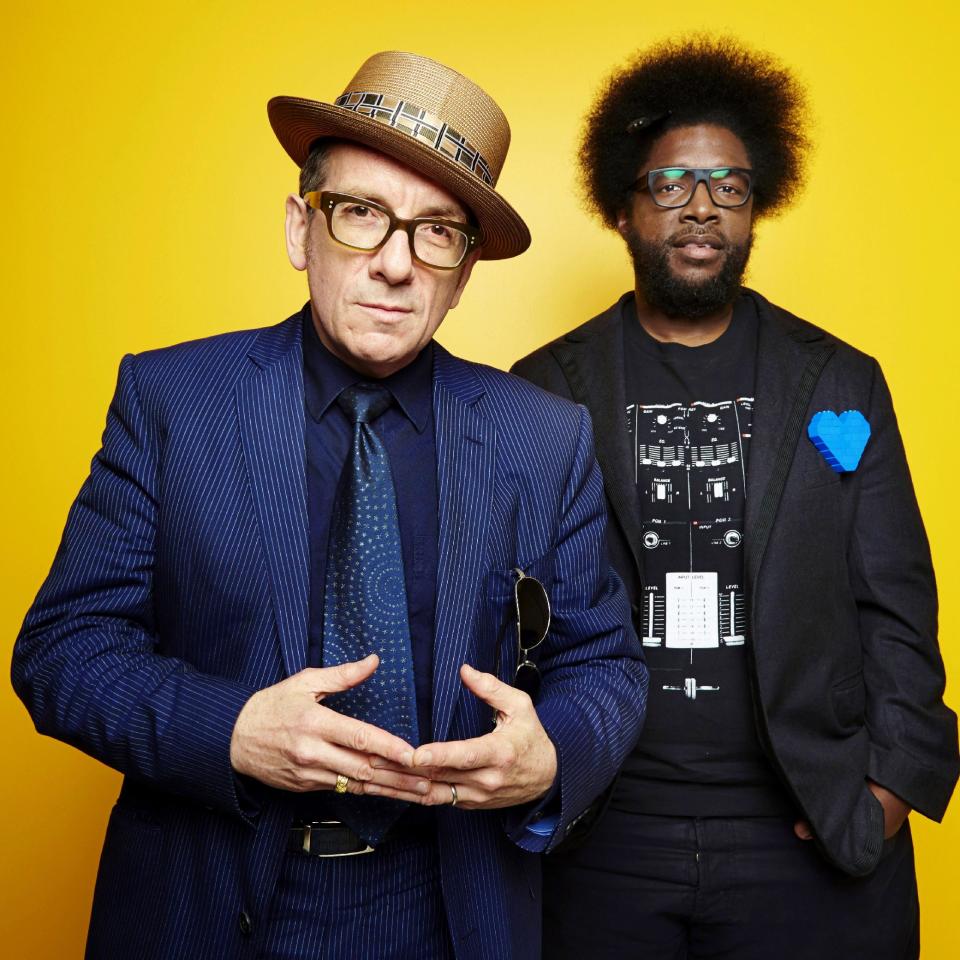 From left, English singer-songwriter Elvis Costello poses for a portrait with drummer Ahmir "Questlove" Thompson of "The Roots," in promotion of their upcoming album "Wise Up Ghost," Tuesday, May 21, 2013, in New York. (Photo by Dan Hallman/Invision/AP)