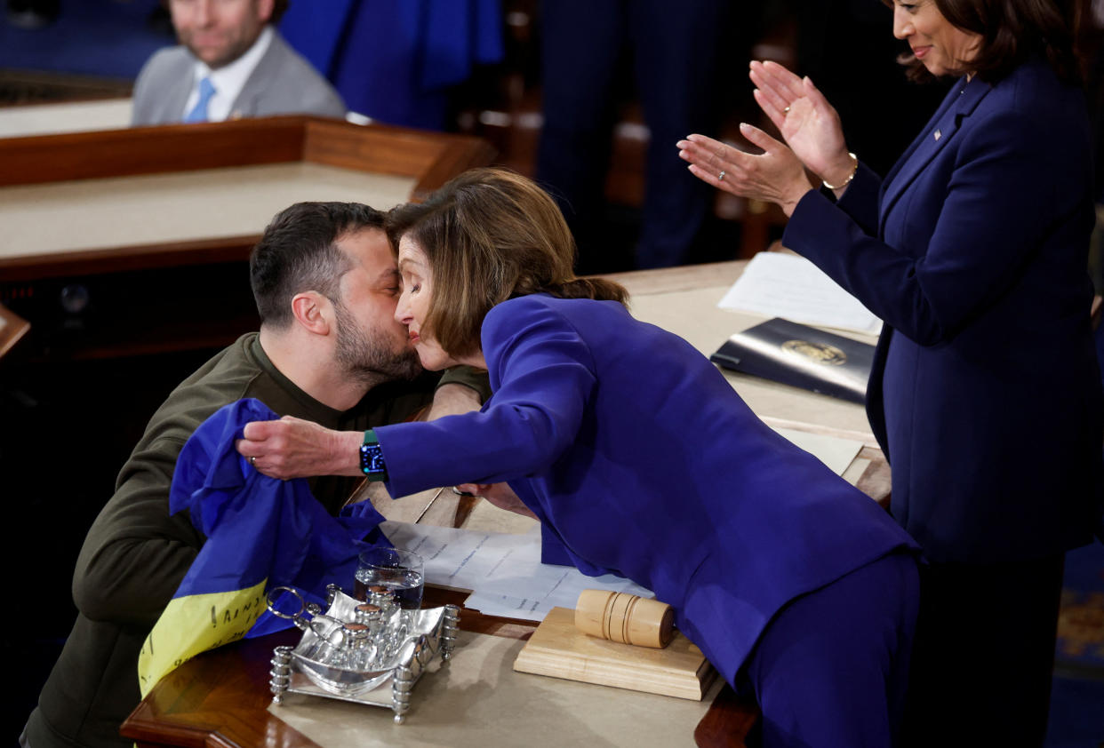 Pelosi receives a peck on the cheek from Zelensky.