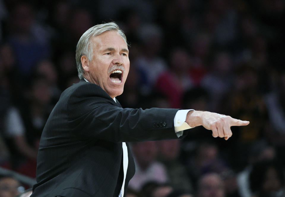 FILE - In this April 13, 2014, file photo, Los Angeles Lakers head coach Mike D'Antoni gestures to his team during the second half of an NBA basketball game against the Memphis Grizzlies in Los Angeles. D'Antoni has resigned after less than two seasons on the job. Lakers spokesman John Black confirmed D'Antoni's resignation Wednesday, April 30. (AP Photo/Mark J. Terrill, File)