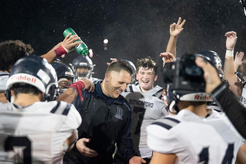 Oct 20, 2023; Park Ridge, NJ, USA; Park Ridge football hosts Rutherford Park at Doc Lewis Field. Rutherford head coach Steve Dunn and his team celebrate defeating Park Ridge.